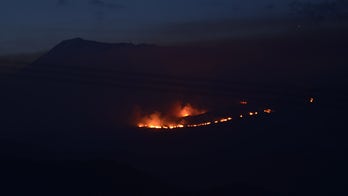 Firefighters battle blaze on Mount Kilimanjaro seen from miles away