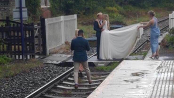 Railway operator blasts bride, groom seen taking wedding pics on railroad tracks: 'Plain stupidity'