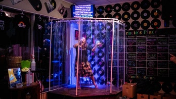 Karaoke bar in Canada puts performers inside 'shower stall' for socially distanced singing