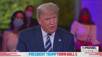 'Nodding lady' at Trump town hall accuses critics of targeting her employees