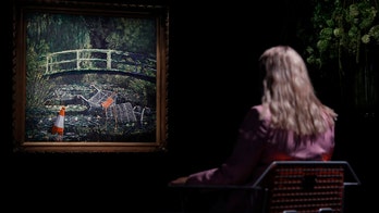 Banksy artwork sells for nearly $10M at auction