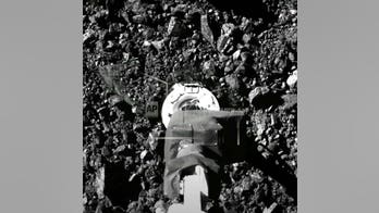 Asteroid samples escaping from jammed NASA spacecraft