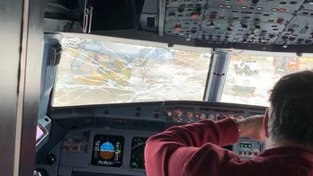 United Airlines flight makes emergency landing after windshield cracks in hail storm