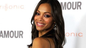 Zoe Saldana poses in pink underwear in honor of Breast Cancer Awareness Month