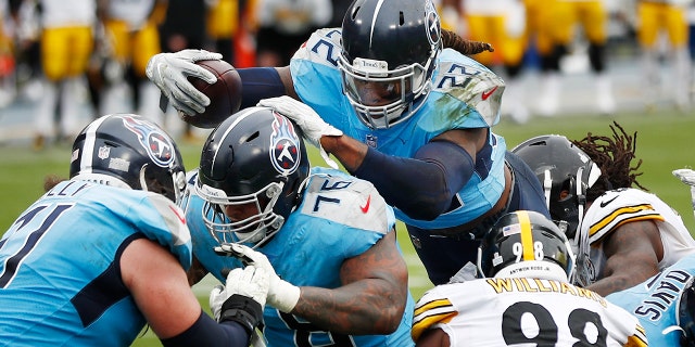 Tennessee Titans running back Derrick Henry (22) follows the blocking of offensive guard Rodger Saffold (76) as Henry scores a touchdown against the Pittsburgh Steelers in the second half of an NFL football game Sunday, Oct. 25, 2020, in Nashville, Tenn. (AP Photo/Wade Payne)