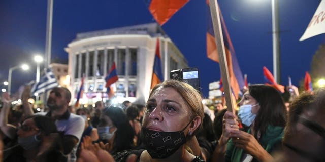 Protesters take part in a demonstration in support of Armenia, in the northern city of Thessaloniki, Greece, Saturday, Oct. 3, 2020. Heavy fighting between Armenia and Azerbaijan continued Saturday in their conflict over the separatist territory of Nagorno-Karabakh, while Azerbaijan's president criticized the international mediators who have tried for decades to resolve the dispute. (AP Photo/Giannis Papanikos)