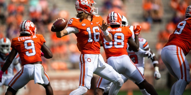 Clemson quarterback Trevor Lawrence (16) throws a pass during an NCAA college football game against Syracuse in Clemson, S.C., on Saturday, Oct. 24, 2020. (Ken Ruinard/Pool Photo via AP)