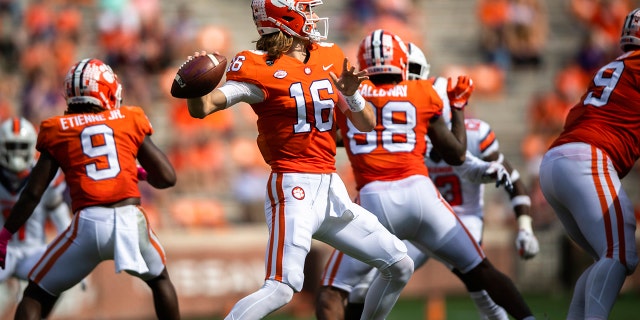 Clemson quarterback Trevor Lawrence (16) throws a pass during an NCAA college football game against Syracuse in Clemson, S.C., on Saturday, Oct. 24, 2020. (Ken Ruinard/Pool Photo via AP)