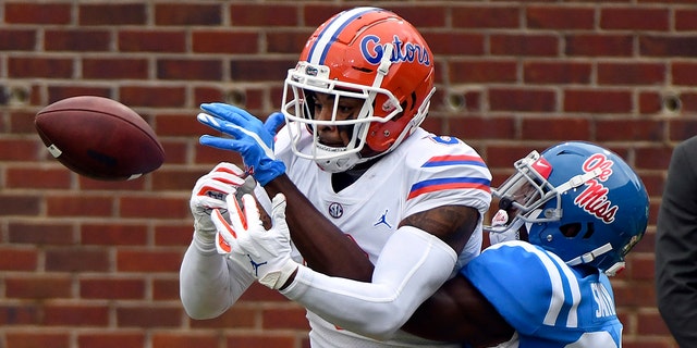 Mississippi defensive back A.J. Finley (21) breaks up a pass intended for Florida wide receiver Trevon Grimes (8) during the first half of an NCAA college football game in Oxford, Miss., Saturday, Sept. 26, 2020. (AP Photo/Thomas Graning)