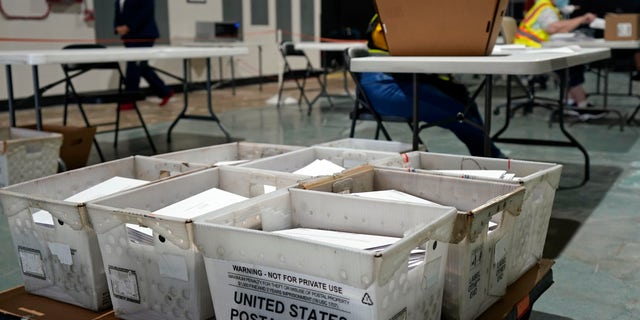 In this Sept. 3, 2020, file photo, workers prepare absentee ballots for mailing at the Wake County Board of Elections in Raleigh, N.C. (AP Photo/Gerry Broome)