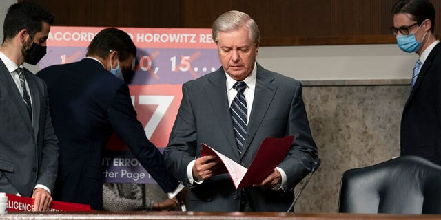 Sen. Lindsey Graham, R-S.C., looks through notes during a Senate Judiciary Committee hearing on Capitol Hill in Washington, Wednesday, Sept. 30, 2020, to examine the FBI "Crossfire Hurricane" investigation. (Stefani Reynolds/Pool via AP)