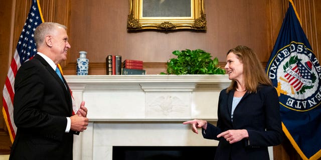 Sen. Thom Tillis, R-N.C., meets with Judge Amy Coney Barrett, President Donald Trump's nominee to the Supreme Court at the U.S. Capitol Wednesday, Sept. 30, 2020, in Washington. (Bill Clark/Pool via AP)