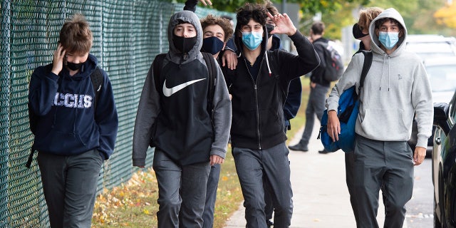 Students from Lasalle Community Comprehensive High School walk out of class to protest COVID-19 safety concerns Thursday, Oct. 1, 2020 in Montreal. (Ryan Remiorz/The Canadian Press via AP)