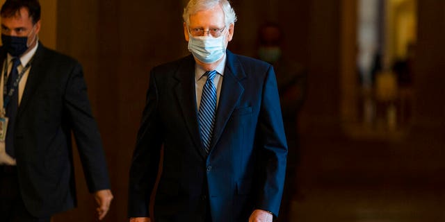 Senate Majority Leader Sen. Mitch McConnell of Ky. walks towards the Senate floor on Capitol Hill, Thursday, Oct. 1, 2020, in Washington.