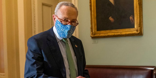 Senate Minority Leader Chuck Schumer walks outside the Senate floor on Capitol Hill, Thursday, Oct. 1, 2020, in Washington. Schumer Tuesday again forced senators to vote on shutting down the Senate until after the election. (AP Photo/Manuel Balce Ceneta)