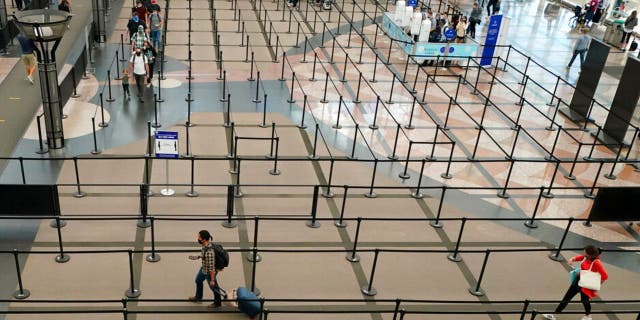The number of travelers passing through TSA checkpoints dropped to fewer than 100,000 on several days earlier this year. (AP Photo/David Zalubowski)