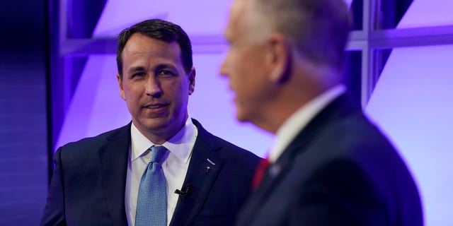 Democratic challenger Cal Cunningham, left, and U.S. Sen. Thom Tillis, R-N.C. talk during a televised debate Thursday, Oct. 1, 2020 in Raleigh, N.C. (AP Photo/Gerry Broome, Pool)