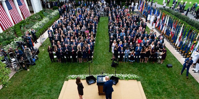 In this Sept. 26, 2020, photo President Donald Trump, center, stands with Judge Amy Coney Barrett as they arrive for a news conference to announce Barrett as his nominee to the Supreme Court, in the Rose Garden at the White House in Washington. Former New Jersey Gov.