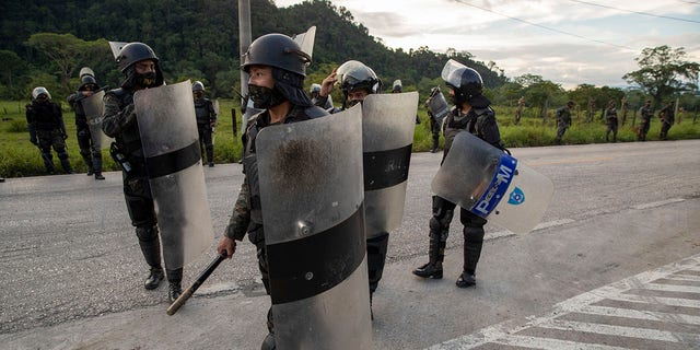 Security forces block Honduran migrants in San Luis Peten, Guatemala, Saturday, Oct. 3, 2020. (Associated Press)