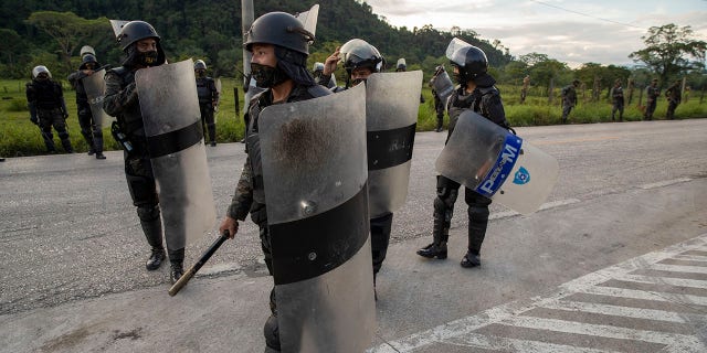 Security forces block Honduran migrants in San Luis Peten, Guatemala, Saturday, October 3, 2020. (Associated Press)