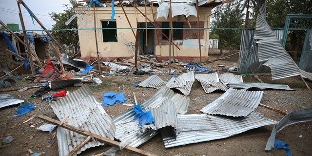 A destroyed house damaged by shelling during fighting over the breakaway region of Nagorno-Karabakh in Terter, Azerbaijan, Saturday, Oct. 3, 2020. Armenia and Azerbaijan say heavy fighting is continuing in their conflict over the separatist territory of Nagorno-Karabakh and Azerbaijan's president said late Saturday his troops had taken a village. (AP Photo/Aziz Karimov)