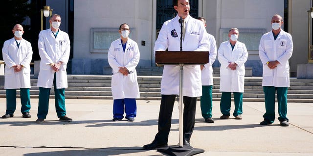 Dr. Sean Conley, physician to President Donald Trump, briefs reporters at Walter Reed National Military Medical Center in Bethesda, Md., Sunday, Oct. 4, 2020. (AP Photo/Jacquelyn Martin)