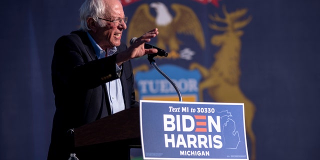 Sen. Bernie Sanders speaks to the crowd at a car rally campaign event for Democratic presidential candidate former Vice President Joe Biden on Monday, Oct. 5, 2020, in Warren, Mich. (Nicole Hester/Ann Arbor News via AP)