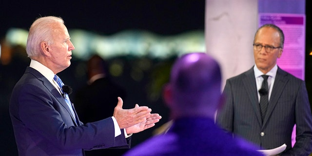 Democratic presidential candidate former Vice President Joe Biden speaks at a NBC Town Hall at Pérez Art Museum, Monday, Oct. 5, 2020, in Miami, with Lester Holt at right. (AP Photo/Andrew Harnik)