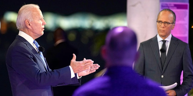 Democratic presidential candidate former Vice President Joe Biden speaks at a NBC Town Hall at Pérez Art Museum, Monday, Oct. 5, 2020, in Miami, with Lester Holt at right. (AP Photo/Andrew Harnik)