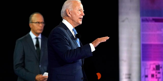 Democratic presidential candidate former Vice President Joe Biden speaks at a NBC Town Hall at Pérez Art Museum, Monday, Oct. 5, 2020, in Miami, as moderator Lester Holt listens. (AP Photo/Andrew Harnik)