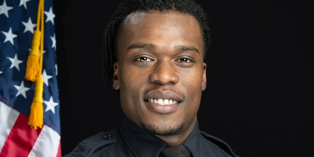 This undated photo provided by the Wauwatosa Police Department in Wauwatosa, Wis., shows Wauwatosa Police Officer Joseph Mensah. In a report released Wednesday, Oct. 7, 2020, an independent investigator recommended officials in the Milwaukee suburb fire Mensah, who has shot and killed three people in the last five years. (Gary Monreal/Monreal Photography LLC/Wauwatosa Police Department via AP)