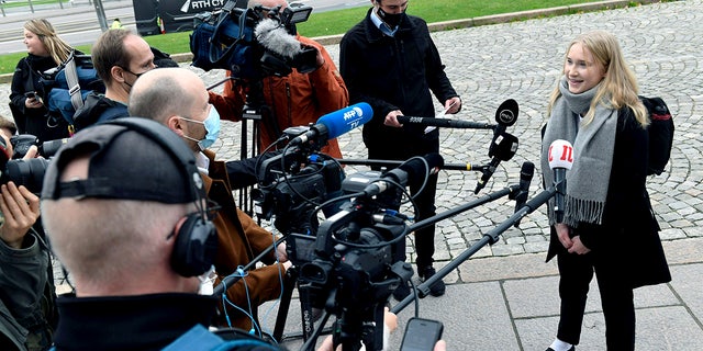 Aava Murto, is interviewed by members of the media, in Helsinki, Finland, Wednesday, Oct. 7, 2020. A 16-year-old girl has assumed the post of Finnish prime minister for one day in the “Girls Takeover” scheme part of the U.Ns’ Day of the Girl to raise more awareness of gender equality in the world. Aava Murto stepped into the shoes of Prime Minister Sanna Marin Wednesday to highlight the impact of technology on gender equality. (Heikki Saukkomaa/Lehtikuva via AP)