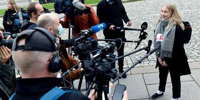 Aava Murto, is interviewed by members of the media, in Helsinki, Finland, Wednesday, Oct. 7, 2020. A 16-year-old girl has assumed the post of Finnish prime minister for one day in the “Girls Takeover” scheme part of the U.Ns’ Day of the Girl to raise more awareness of gender equality in the world. Aava Murto stepped into the shoes of Prime Minister Sanna Marin Wednesday to highlight the impact of technology on gender equality. (Heikki Saukkomaa/Lehtikuva via AP)