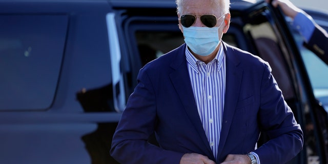 Democratic presidential candidate former Vice President Joe Biden walks to board his campaign plane at New Castle Airport in New Castle, Del., Thursday, Oct. 8, 2020., en route to Arizona. (AP Photo/Carolyn Kaster)