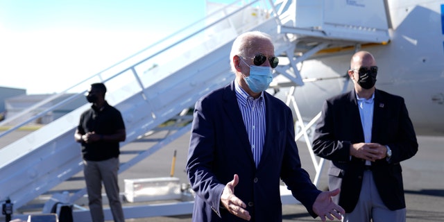Democratic presidential candidate former Vice President Joe Biden speaks to members of the media before boarding his campaign plane at New Castle Airport in New Castle, Del., Thursday, Oct. 8, 2020., en route to Arizona. (AP Photo/Carolyn Kaster)