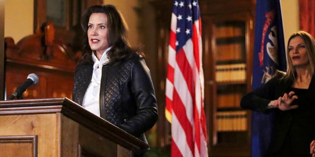 In a photo provided by the Michigan Office of the Governor, Michigan Gov. Gretchen Whitmer addresses the state during a speech in Lansing, Mich., Thursday, Oct. 8, 2020. The governor delivered remarks addressing Michiganders after the Michigan Attorney General, Michigan State Police, U.S. Department of Justice, and FBI announced state and federal charges against 13 members of two militia groups who were preparing to kidnap and possibly kill the governor. (Michigan Office of the Governor via AP)