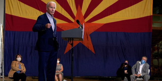 Democratic presidential candidate former Vice President Joe Biden speaks at the Carpenters Local Union 1912 in Phoenix, Thursday, Oct. 8, 2020, to kick off a small business bus tour. (AP Photo/Carolyn Kaster)