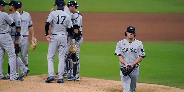 New York Yankees' Gerrit Cole walks to the dugout after being removed during the sixth inning in Game 5 of the baseball team's AL Division Series against the Tampa Bay Rays, Friday, Oct. 9, 2020, in San Diego. (Associated Press)