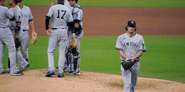 New York Yankees' Gerrit Cole walks to the dugout after being removed during the sixth inning in Game 5 of the baseball team's AL Division Series against the Tampa Bay Rays, Friday, Oct. 9, 2020, in San Diego. (Associated Press)