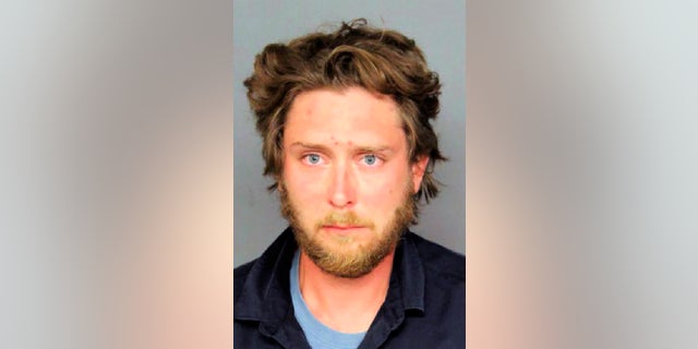 Denver police identified Matthew Dolloff, 30, as the suspect in a fatal shooting that took place in downtown Denver during dueling protests. Dolloff, a private security guard working for local television station KUSA TV, has charged with second-degree murder in the death of 49-year-old Lee Keltner. (Denver Police Department via AP)