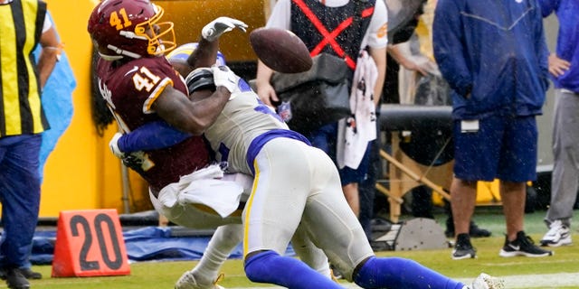 Los Angeles Rams' Jordan Fuller breaks up a pass intended for Washington Football Team's J.D. McKissic during the second half of an NFL football game Sunday, Oct. 11, 2020, in Landover, Md. (AP Photo/Steve Helber)