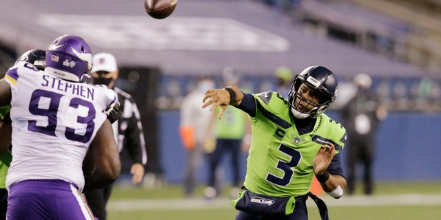 Seattle Seahawks quarterback Russell Wilson throws against the Minnesota Vikings during the second half of an NFL football game, Sunday, Oct. 11, 2020, in Seattle. (AP Photo/John Froschauer)