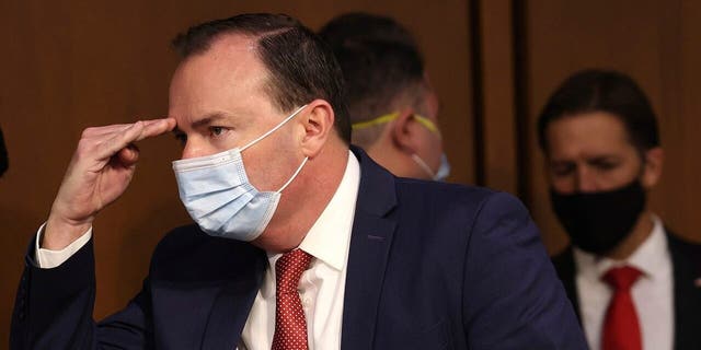 Sen. Mike Lee., R-Utah, arrives for the confirmation hearing of Amy Coney Barrett before Senate Judiciary Committee on Capitol Hill in Washington, Monday, Oct. 12, 2020. (Win McNamee/Pool via AP)