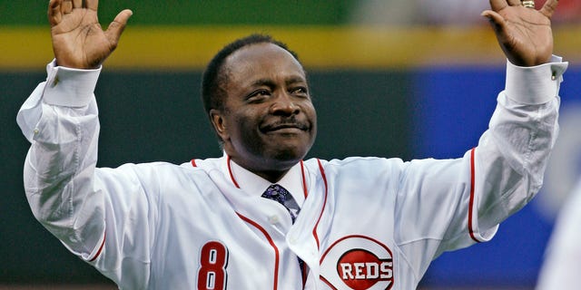FILE - In this Wednesday, April 7, 2010, file photo, Cincinnati Reds Hall of Fame second baseman Joe Morgan acknowledges the crowd after throwing out a ceremonial first pitch prior to the Reds' baseball game against the St. Louis Cardinals, in Cincinnati. Hall of Fame second baseman Joe Morgan has died. A family spokesman says he died at his home Sunday, Oct. 11, 2020, in Danville, California. (AP Photo/Al Behrman)