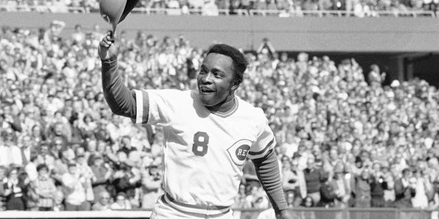 FILE - In this Saturday, Oct. 16, 1976, file photo, Cincinnati second baseman Joe Morgan tips his helmet to the fans as he rounds the bases after a homer in the first inning against the New York Yankees at Riverfront Stadium in Cincinnati. Hall of Fame second baseman Joe Morgan has died. A family spokesman says he died at his home Sunday, Oct. 11, 2020, in Danville, Calif. (AP Photo/File)