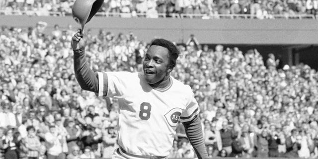 FILE - In this Saturday, Oct. 16, 1976, file photo, Cincinnati second baseman Joe Morgan tips his helmet to the fans as he rounds the bases after a homer in the first inning against the New York Yankees at Riverfront Stadium in Cincinnati. Hall of Fame second baseman Joe Morgan has died. A family spokesman says he died at his home Sunday, Oct. 11, 2020, in Danville, Calif. (AP Photo/File)