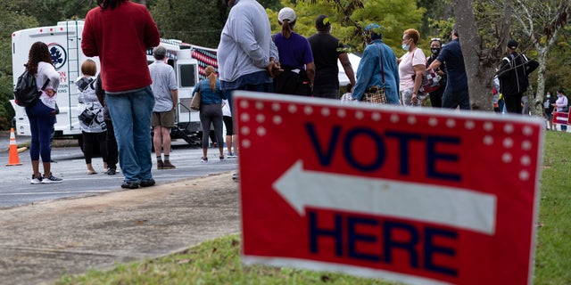 Voters line up for early voting at a Fulton County mobile voting station on Oct. 12, 2020 at St. Paul's Episcopal Church in Southwest Atlanta. (Ben Gray/Atlanta Journal-Constitution via AP)