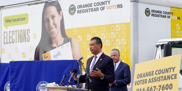 In this Oct. 5, 2020, file photo, California Secretary of State Alex Padilla, left, and Orange County Registrar of Voters Neal Kelley hold a news conference on Orange County's comprehensive plans to safeguard the election and provide transparency in Santa Ana, Calif. (AP Photo/Damian Dovarganes, File)