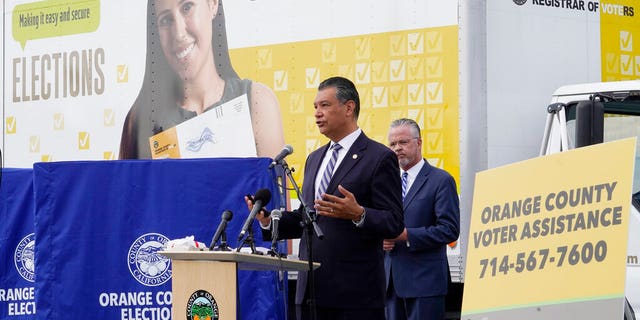 In this Oct. 5, 2020, file photo, California Secretary of State Alex Padilla, left, and Orange County Registrar of Voters Neal Kelley hold a news conference on Orange County's comprehensive plans to safeguard the election and provide transparency in Santa Ana, Calif. (AP Photo/Damian Dovarganes, File)