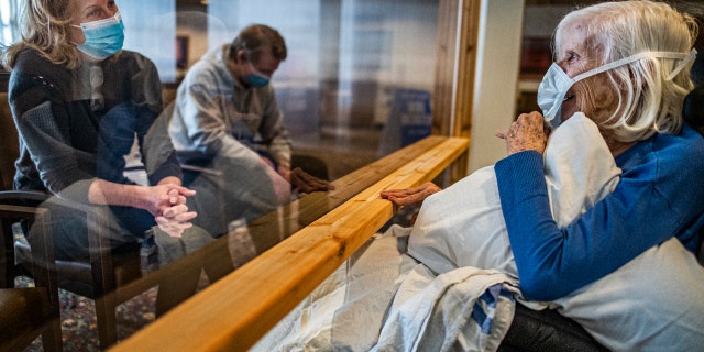 Carla Gillespie with her son Dylan visited her mother, Evelyn Solberg, at the Jones-Harrison Residence. (RICHARD TSONG-TAATARII ¥ richard.tsong-taatarii@startribune.comrin)